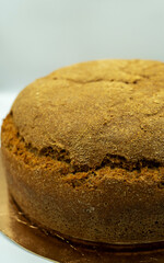 Fresh vegan bread on the table close-up in flour scattering. Healthy food and traditional bakery concept. Vegetarian meal concept