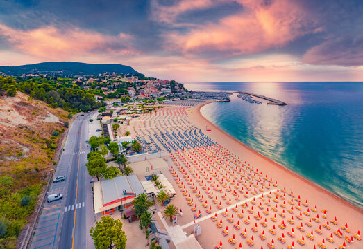 Aerial landscape photography. Colorful summer sunrise in Numana public beach. Picturesque seascape of Adriatic sea. Splendid outdoor scene of Italy, Europe. Traveling concept background.