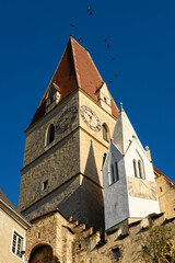 Fototapeta premium Church of Weissenkirchen Wachau Austria on a sunny day in winter