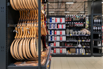 Cooking pans on the shelf in the supermarket. Frying pans in store.