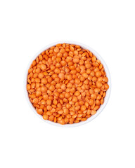 Red lentils in white bowl isolated on white background.