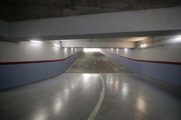 Shallow depth of field (selective focus) image with the entrance - exit of an underground parking.