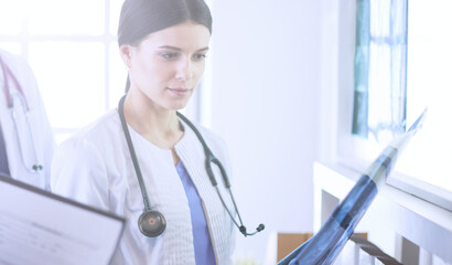 Group of doctors checking x-rays in a hospital