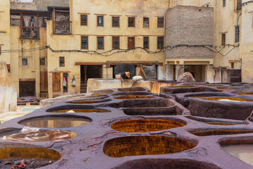 Old tanks of the Fez's tanneries with color paint for leather, Morocco, Africa