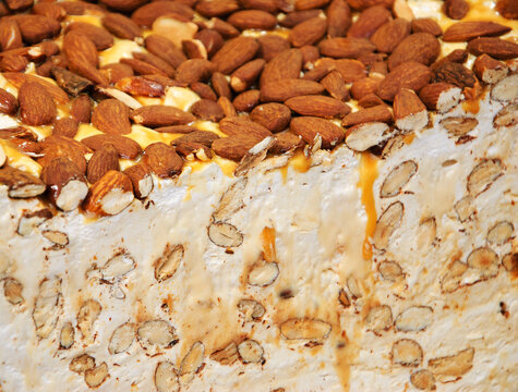 Delicious Halva with almonds and honey. Close up. Selective focus.