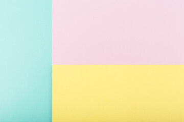 Fototapeta premium Elegant simple colored background made of light pastel purple, yellow and mint blue background with copy space
