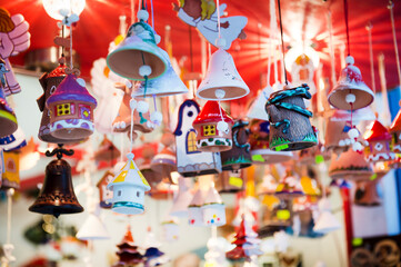 New Year's Christmas decorations, bells, houses, angels, souvenirs at the Christmas market in the shop. Pendants, handmade ceramics. Can be used for websites, brochures, posters, printing and design.