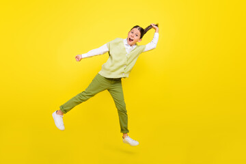 Fototapeta na wymiar Full length body size view of attractive funny cheerful girl jumping making tail having fun isolated on bright yellow color background