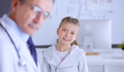 Little children with her mother at a doctor on consultation