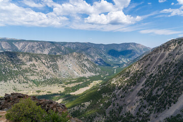 View from Rock Creek Vista on the Bearthooth Highway in Wyoming and Montana on a sunny and cloudy summer day