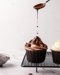 Chocolate cupcake with chocolate syrup