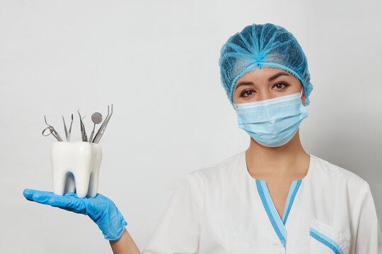 Portrait of dentist woman with dental tools