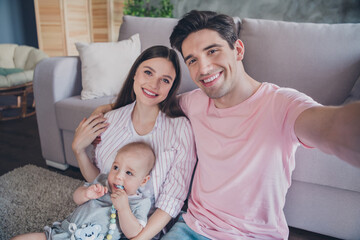 Fototapeta premium Photo of father cuddle mom kid shoot family self portrait wear casual outfit in comfortable apartment home indoors