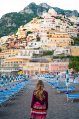 Fototapeta na wymiar A young blonde girl in Positano, Amalfi Coast, Campania, Italy