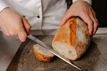 person slicing bread