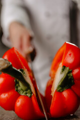 person slicing tomato