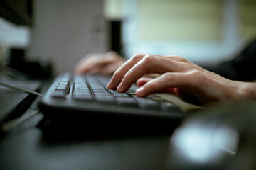 Female hands or woman office worker typing on the keyboard - obrazy, fototapety, plakaty