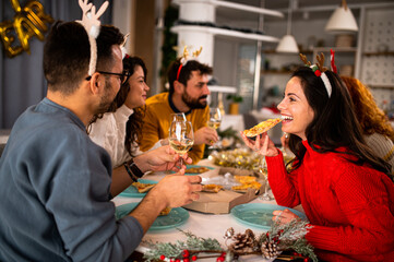 Group of friends at dinner. Christmas dinner. 