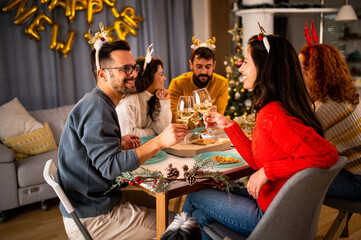 Young couple at Christmas dinner