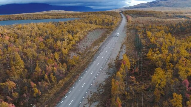 50fps drone footgage Car Camping Caravan driving road lake Swedish Lapland Sunny fall colors Abisko National Park Sweden