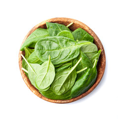 Spinach leaves in wooden plate
