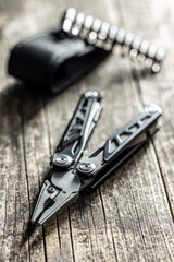 Multi-tools pliers with other tools and knife. Multifunction pliers.