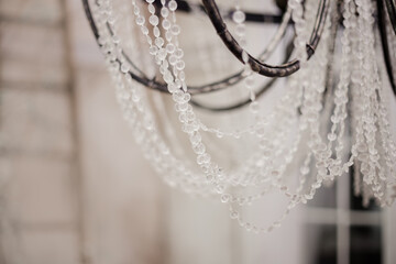 Crystal chandelier close-up. For web desktop wallpaper, card, invitation, wedding or baby shower album, background, art.