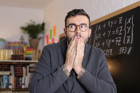 Astonished Teacher Covering His Mouth