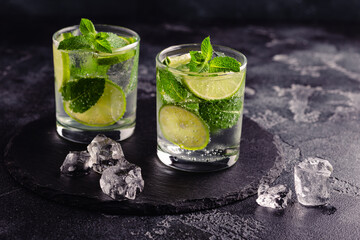 Refreshing summer alcoholic cocktail mojito with ice, fresh mint and lime