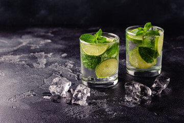 Refreshing summer alcoholic cocktail mojito with ice, fresh mint and lime
