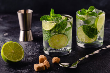 Refreshing summer alcoholic cocktail mojito with ice, fresh mint and lime