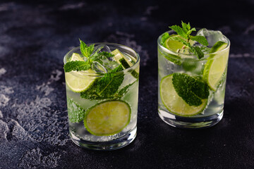 Refreshing summer alcoholic cocktail mojito with ice, fresh mint and lime