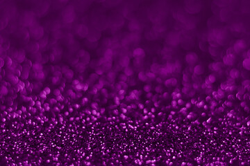 Velvet violet sparkling glitter background, christmas abstract shiny texture. Holiday lights