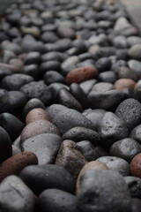 Fototapeta na wymiar pile of black stones on the ground