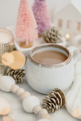 Cozy Winter Styled Coffee with Pink and Gold Accents 