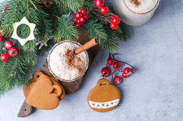 New Year's drink on a concrete background with gingerbread, cinnamon and Christmas decor, flat layout