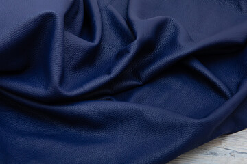 Obraz premium blue folded natural cow leather - material for handbags and shoes 