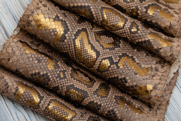 spotted gold brown colored natural python genuine leather	

