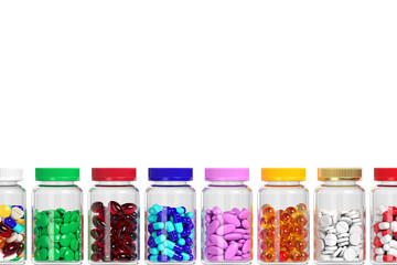 Isolated row of jars with different tablets and pills. Variety of vitamins and dietary supplements. Production of drugs. Medical theme. 3d rendering. 