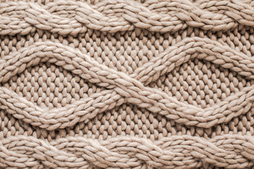 Fototapeta na wymiar Beige knitting wool texture background. Woolen handmade knitted clothes texture.