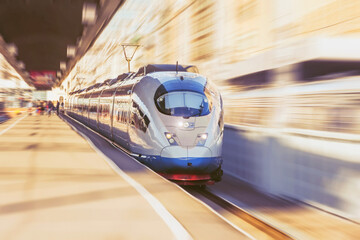 Naklejka na ściany i meble Record breaking fast passenger electric train sets off on a journey.