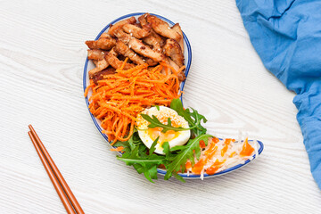 Bibimbap, traditionally Korean food on white wooden table