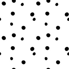 Seamless vector pattern in polka dots black on a white background