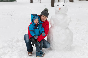Mom and son made a snowman