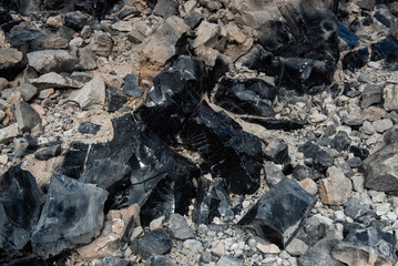 Black obsidian glass rocks in Newberry caldera in Oregon