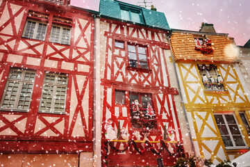 Old medieval houses in Orleans during winter snow
