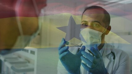 Animation of flag of ghana with male doctor in face mask showing covid vaccine to patient - Powered by Adobe