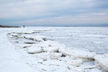 Winter seaside landscape - beach and frozen Baltic Sea near Mikoszewo, Zulawy Wislane, Poland