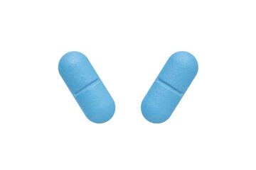 Blue oval pills isolated on white background.