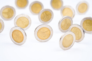 Money coins stand on the edge in many positions, deversify the risk in investment, financial planning, or currency concept